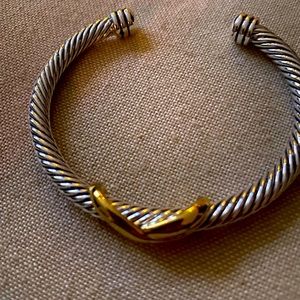 Silver rope bracelet with gold crisscross. Resembles David Yurman